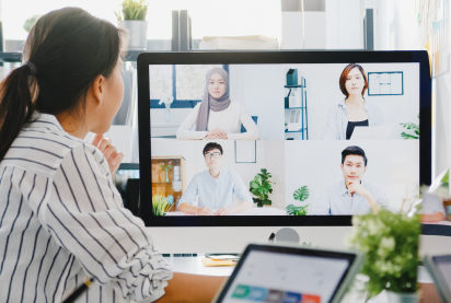 woman with screen showing others in the video call