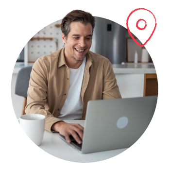 Man working at a laptop with a location pin illustration in the upper right corner.